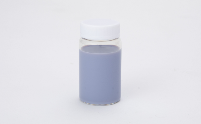 Glass container with lavender-colored liquid