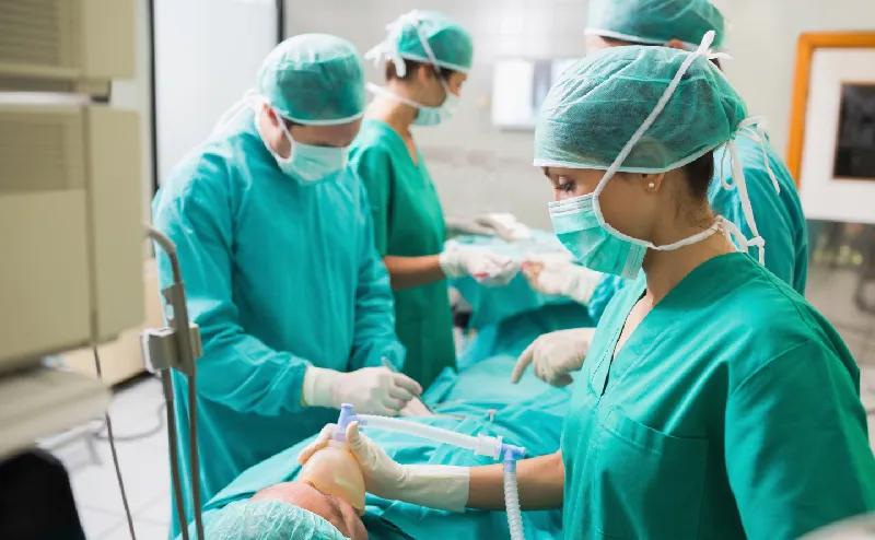 otal of four doctors and medical staff in green surgical gowns are performing a surgery. Mesh is also used for medical applications.