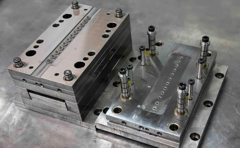 Photo of an open injection mold used for molded filters.