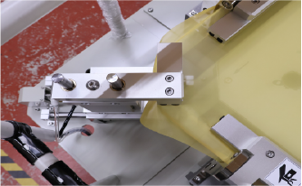 Close-up photo of the corner section of a screen stretching machine